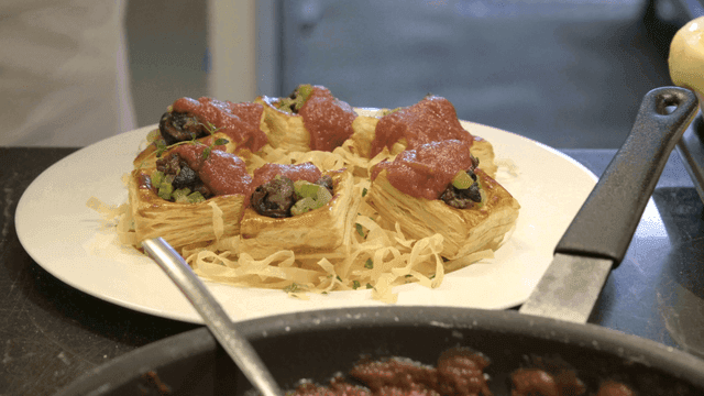 Chef preparing pastry with sauce