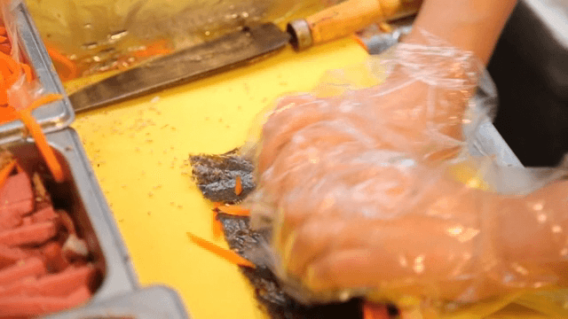 Rolling out kimbap using various ingredients