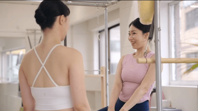Pilates instructor greeting students