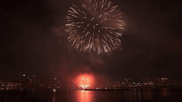 Fireworks display over a city skyline