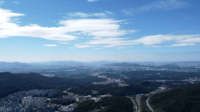 Vast city landscape surrounded by mountains