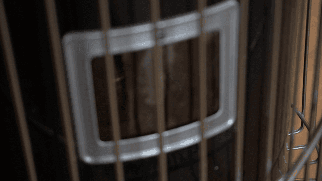 Close-up of a heating heater with visible flames