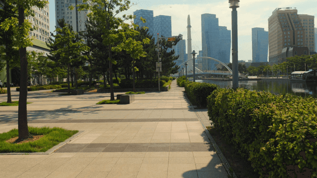 Modern cityscape with trees and river