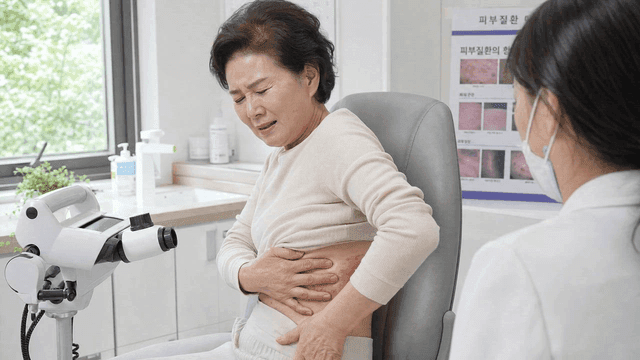Elderly person showing their skin condition to doctor