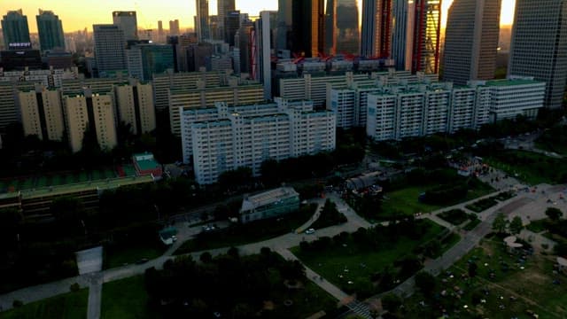 Cityscape at Sunset with Lush Park