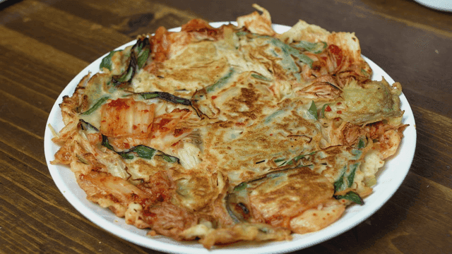 Kimchi pancake on wooden table