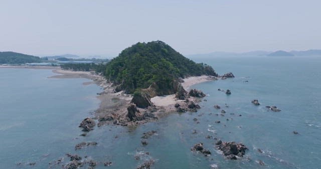 Serene Coastal Landscape with Lush Green Islet