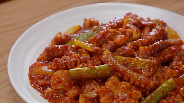 Delicious spicy stir-fried octopus with water parsley