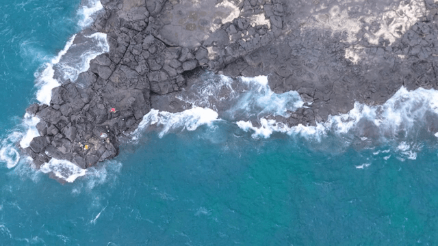 Waves crashing on rocky shore