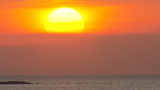 Sun Setting over the Ocean Horizon