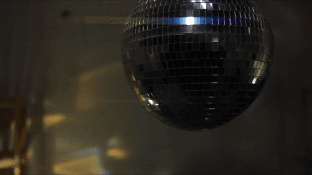 Disco ball reflecting colorful lights