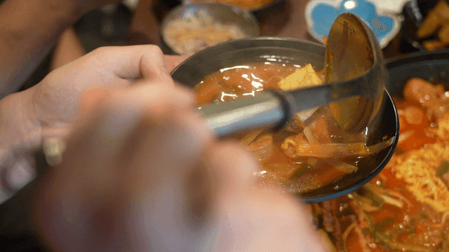 Budaejjigae being served into bowl
