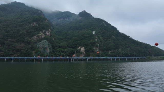 Misty Mountain Scenery with a Serene Lake