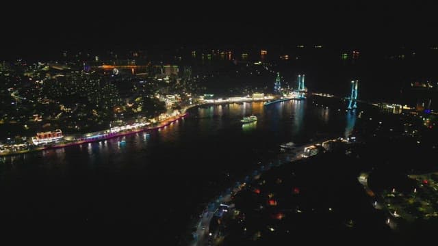 조명이 밝은 다리가 보이는 활기찬 도시 풍경