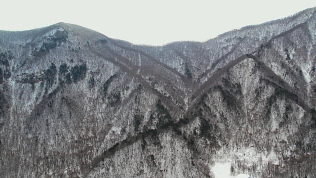 Majestic Landscape of Snow-Capped Mountains in Winter