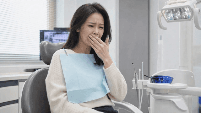 Female patients experiencing discomfort at dental clinic
