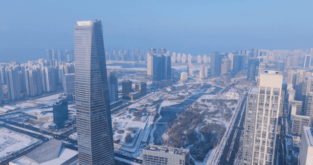 Snow-covered cityscape with skyscrapers