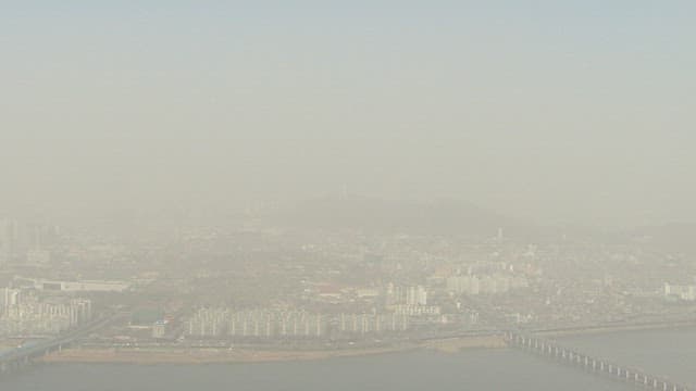 Hazy Cityscape with Bridge and Tower