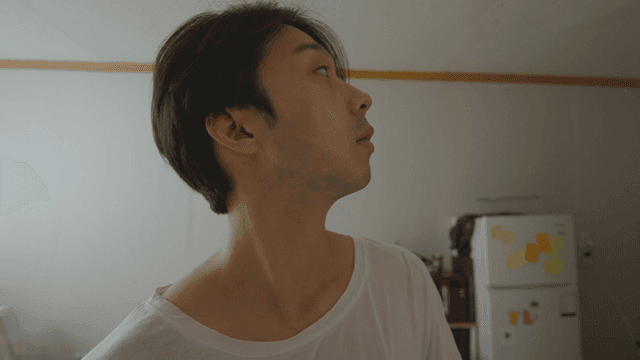 Man looking around his studio room