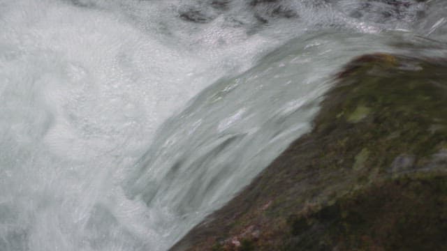 Flowing water over mossy rocks