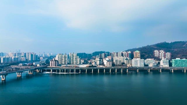 Cityscape with Bridge and River View in Midday