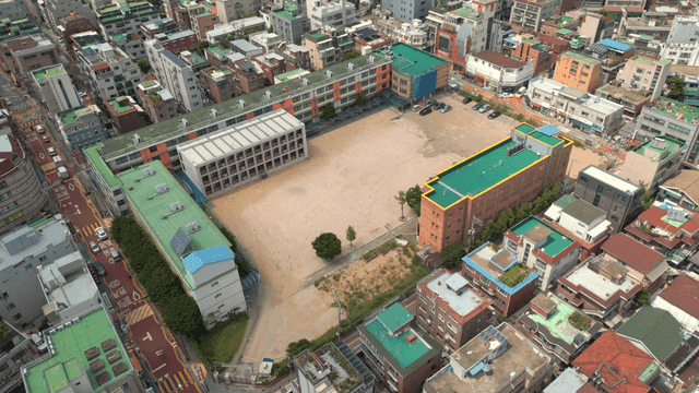 Aerial view of a school in a city