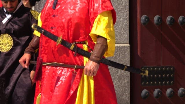 Gatekeeper wearing traditional Korean clothing, hanbok, guarding Gwanghwamun