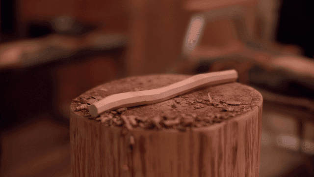 Wooden piece on a stump in a workshop