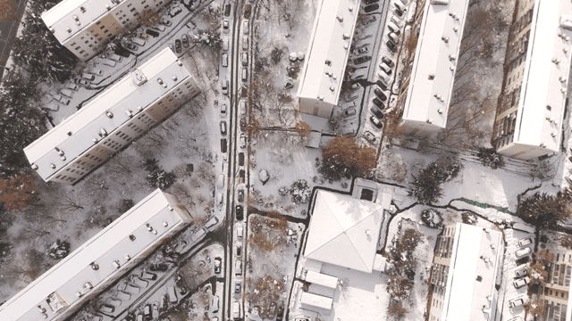 Snow-covered city landscape and apartments
