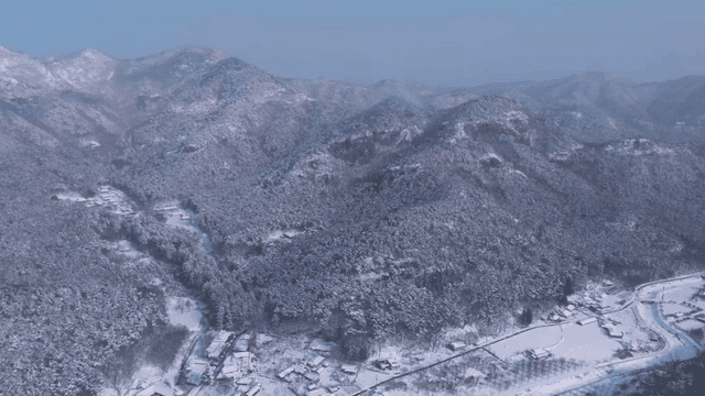 Snow-covered mountains and rural villages