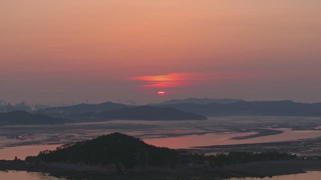 Sunset over an distant mountains