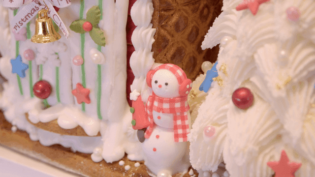 Christmas gingerbread house with snowman decoration