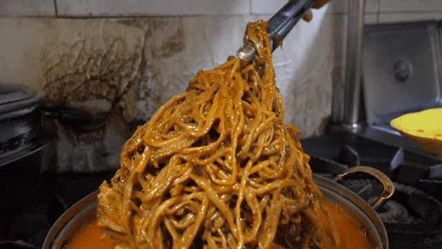 Pork backbone stew with sweet potato stems on top