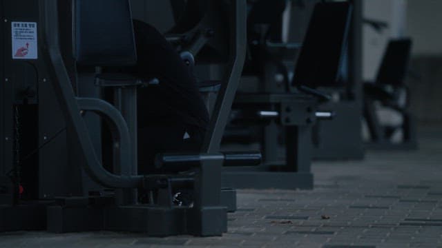 Person exercising on outdoor gym equipment