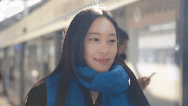 Woman moving on a subway station platform