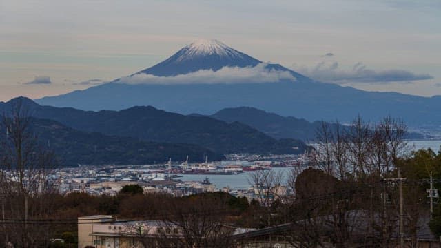 Mount Fuji with a cityscape at dusk