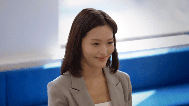 Smiling female office worker in conference room