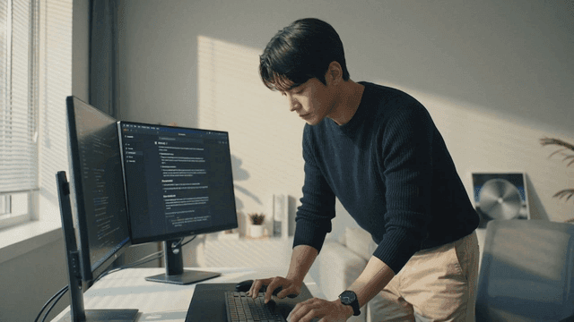 Man concentrating on computer coding