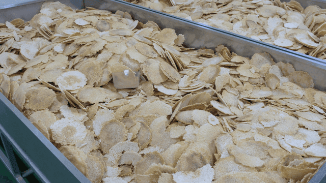 A large container filled with rice crackers