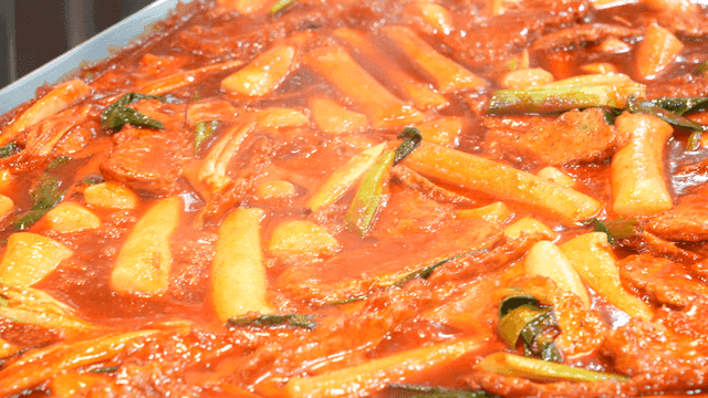 Spicy tteokbokki simmering in a pot