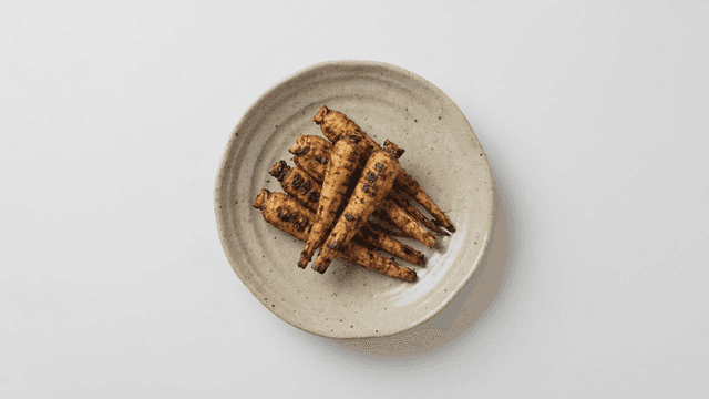 Grilled deodeok on ceramic plate