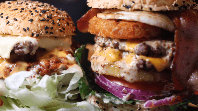 Juicy large burger with cheese and garnish
