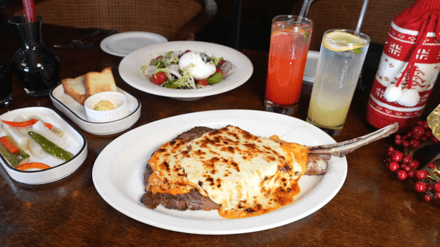 Dinner table with steak and salad