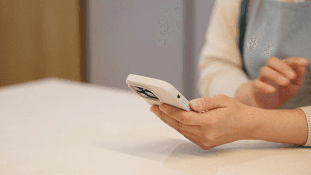 Woman's hand using smartphone