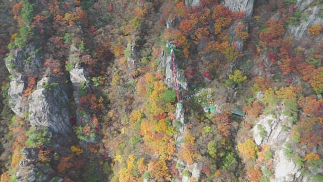 Colorful autumn mountain with rocky cliffs