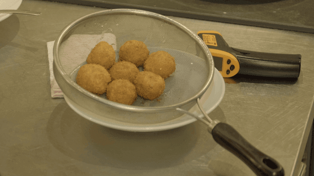 Fried balls in sieve