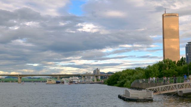 Riverside view with a tall building