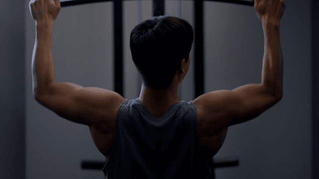 Man doing lat pulldown workout in gym