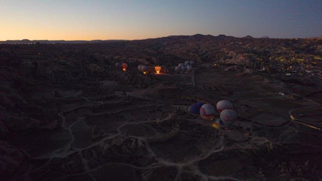 Hot Air Balloons Preparing for Flight at Dawn