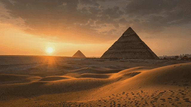 Pyramids at sunset with a glowing sky